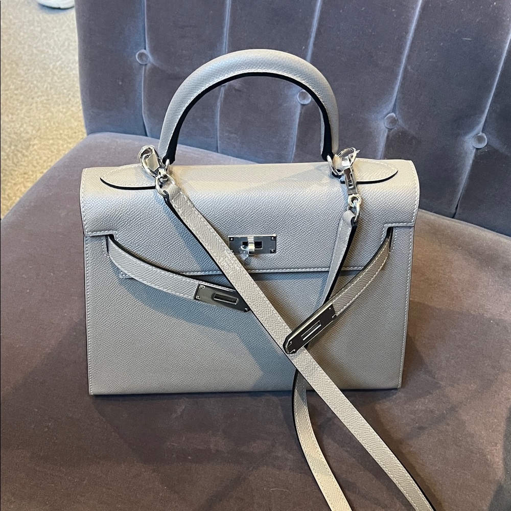 Elegant etoupe Handbag with silver color hardware. Size 28cm